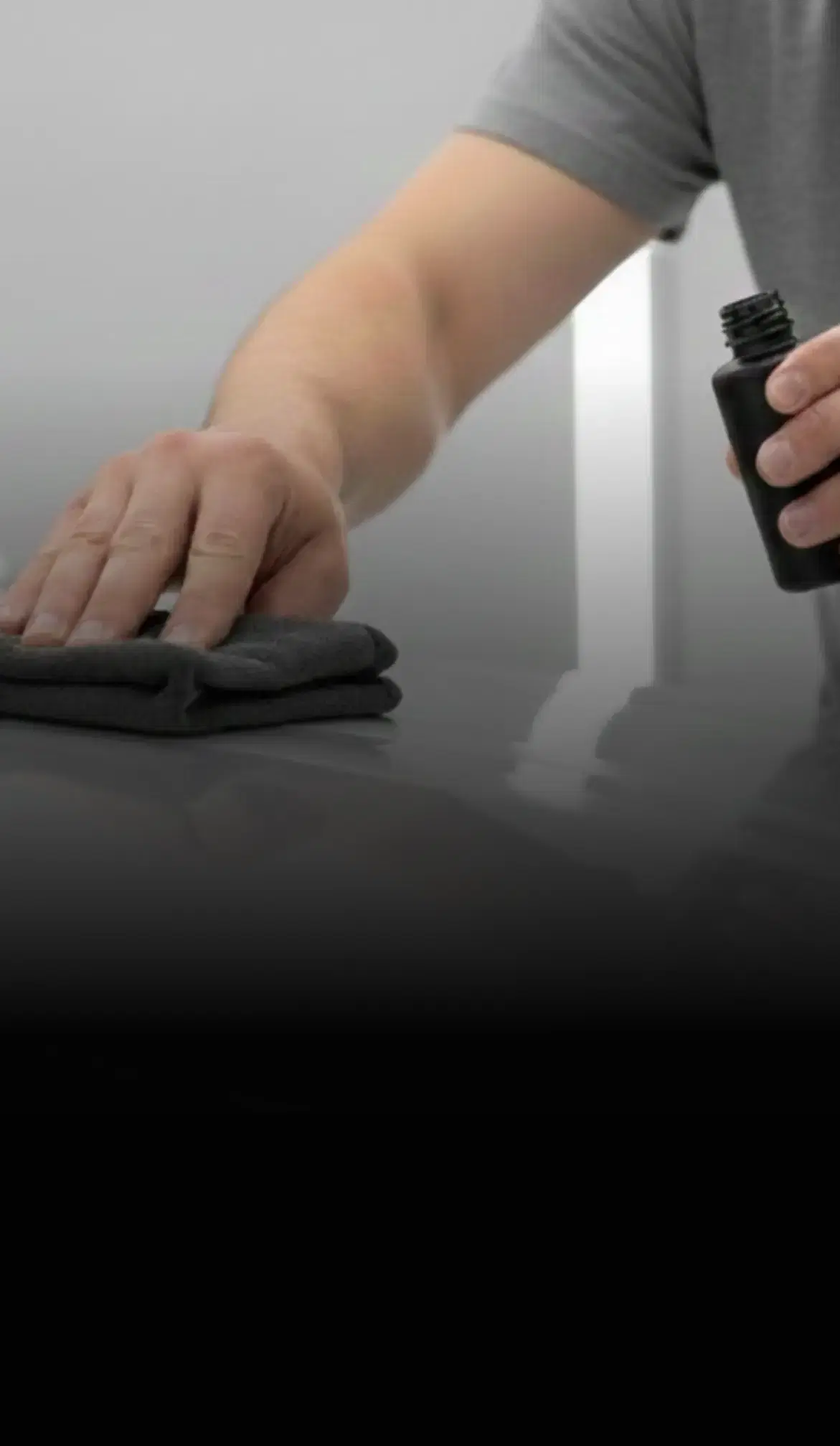 A car with a towel and cleaning supplies, showcasing Speed Shield USA's automotive detailing and protection services.