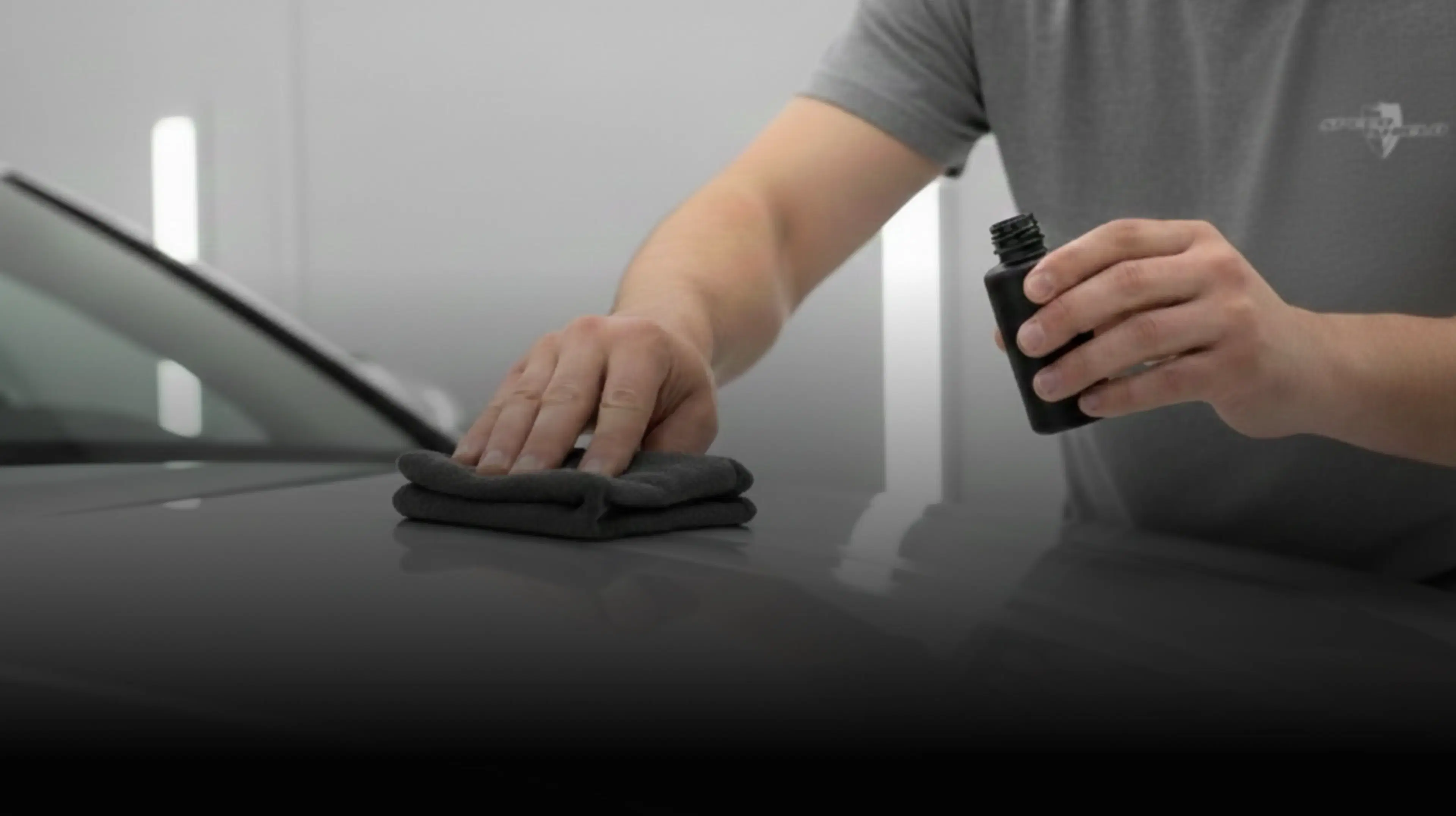 A car with a towel and cleaning supplies, showcasing Speed Shield USA's automotive detailing and protection services.