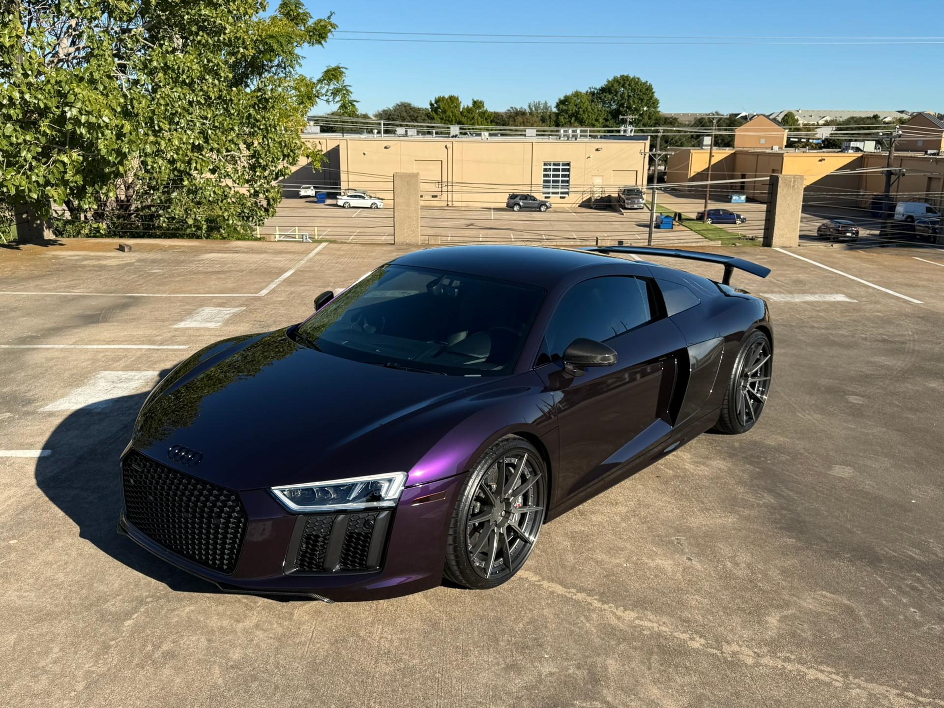 Purple Audi sports car parked, highlighting its glossy exterior and PPF protection from Speed Shield USA.