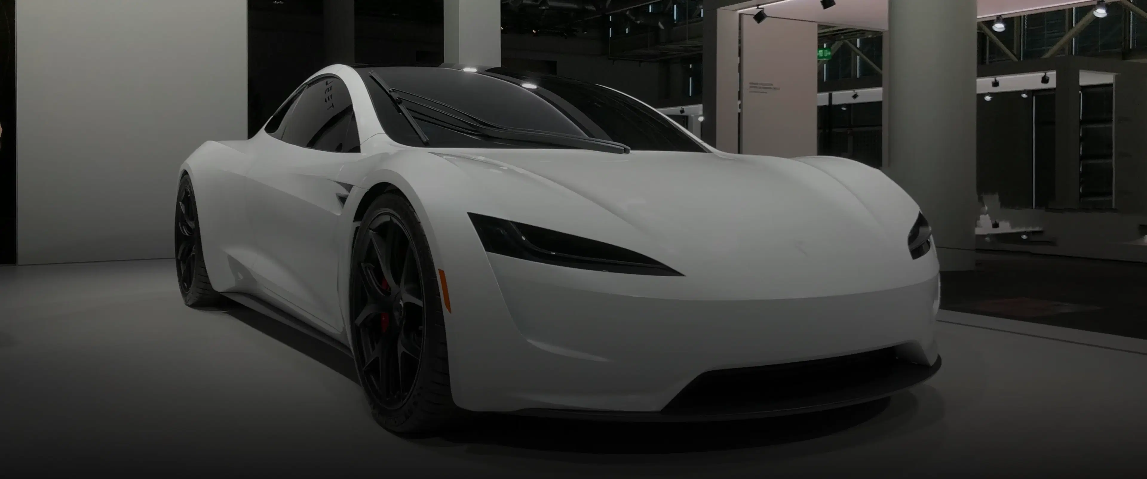 Installer wrapping a car in blue vinyl, highlighting Speed Shield USA's expertise in paint protection and vehicle wraps