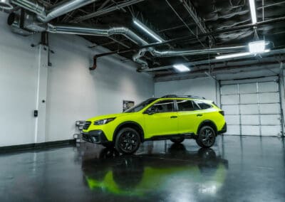 Yellow Subaru Outback