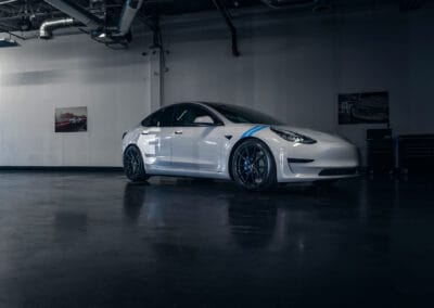 Gray and Blue Clean Tesla Model 3 with Vorsteiner Wheels